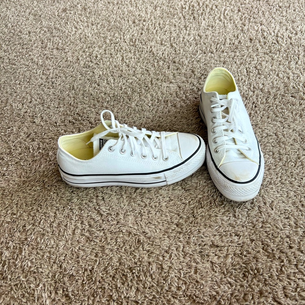 Hardly worn white platform Converse shoes.